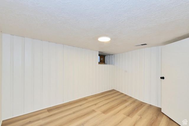 557 E Cleveland Ave, Salt Lake City, UT 84105 - finished below grade area with wood finished floors and a textured ceiling