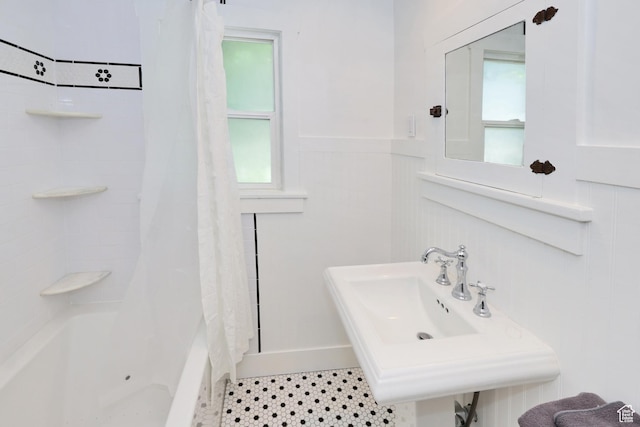 557 E Cleveland Ave, Salt Lake City, UT 84105 - full bathroom with a wainscoted wall, shower / bath combination with curtain, and a sink