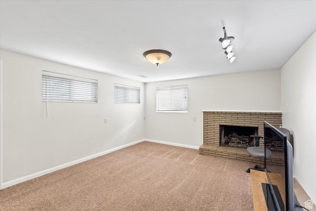 5824 S 2150 W, Roy, UT 84067 - unfurnished living room with carpet, a brick fireplace, and baseboards