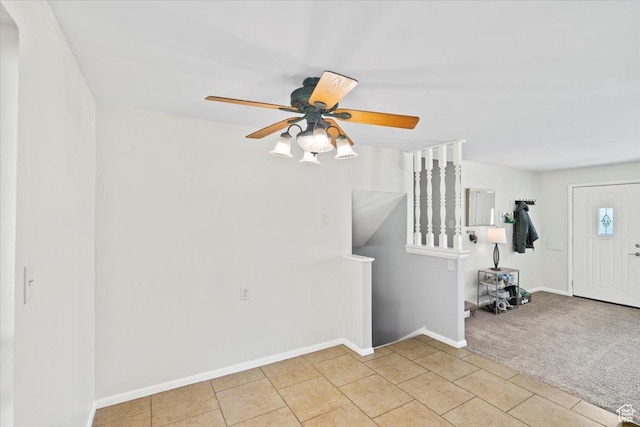 5824 S 2150 W, Roy, UT 84067 - foyer entrance with a ceiling fan, baseboards, light colored carpet, and light tile patterned floors
