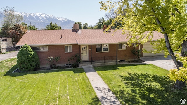 253 S 100 W, American Fork, UT 84003 - single story home featuring brick siding, a front yard, a mountain view, driveway, and an attached garage