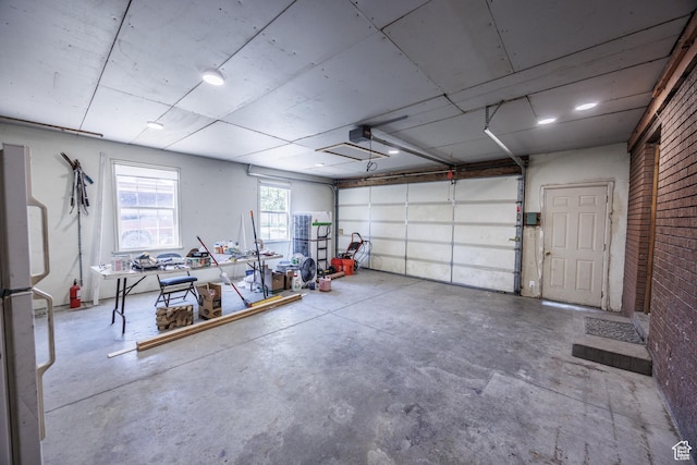 253 S 100 W, American Fork, UT 84003 - garage featuring freestanding refrigerator and a garage door opener