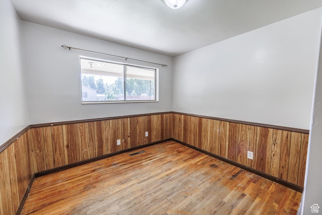 253 S 100 W, American Fork, UT 84003 - spare room with wainscoting, wood finished floors, and wood walls