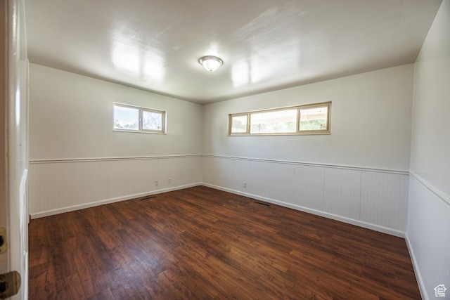 253 S 100 W, American Fork, UT 84003 - empty room featuring dark wood finished floors, wainscoting, and healthy amount of natural light