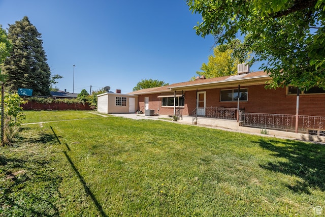 253 S 100 W, American Fork, UT 84003 - rear view of house featuring brick siding and a patio
