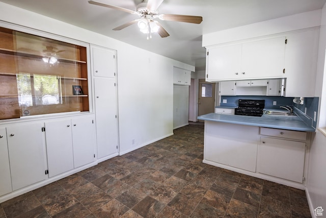 253 S 100 W, American Fork, UT 84003 - kitchen with gas stove, a sink, ceiling fan, white cabinetry, and stone finish floors
