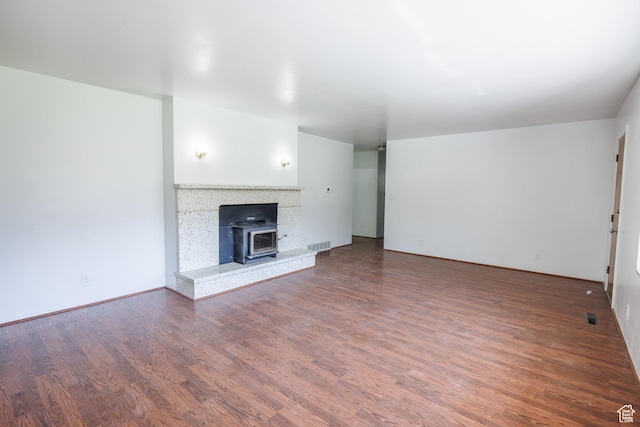 253 S 100 W, American Fork, UT 84003 - unfurnished living room featuring wood finished floors and a wood stove