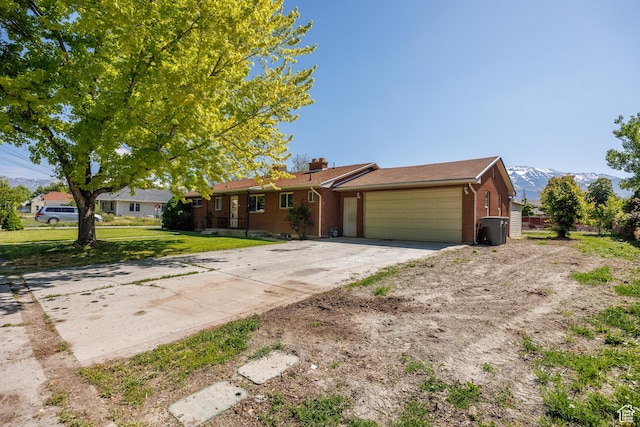 253 S 100 W, American Fork, UT 84003 - single story home with an attached garage, concrete driveway, brick siding, and a chimney