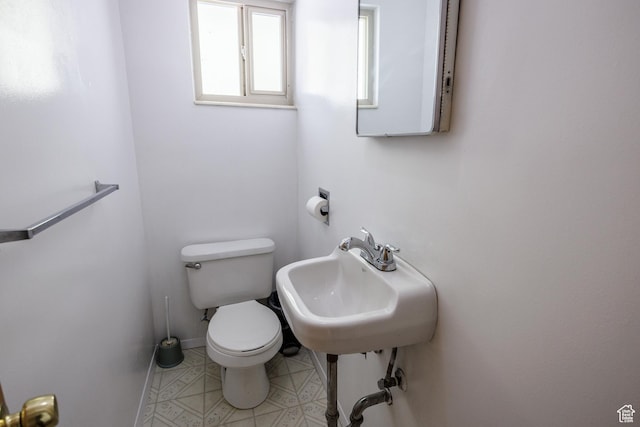 253 S 100 W, American Fork, UT 84003 - half bathroom featuring toilet, a sink, tile patterned flooring, and baseboards