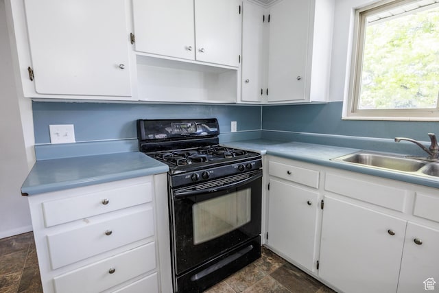 253 S 100 W, American Fork, UT 84003 - kitchen with black range with gas stovetop, stone finish floors, a sink, and white cabinets