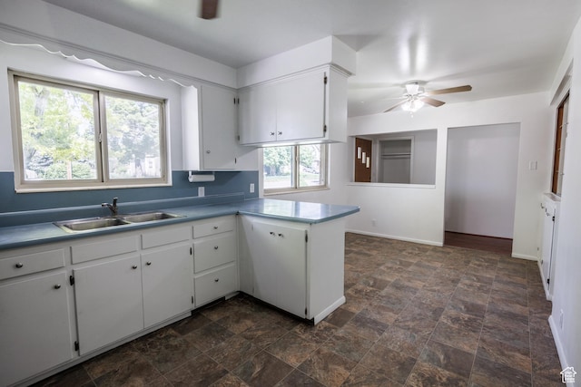 253 S 100 W, American Fork, UT 84003 - kitchen featuring ceiling fan, a sink, stone finish floors, and white cabinets