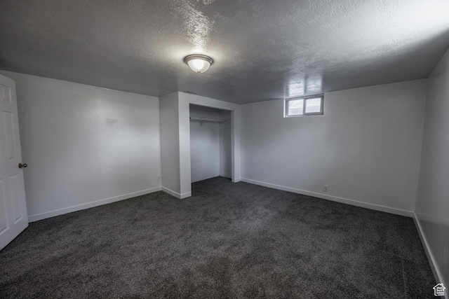 253 S 100 W, American Fork, UT 84003 - unfurnished bedroom with a textured ceiling, dark colored carpet, baseboards, and a closet