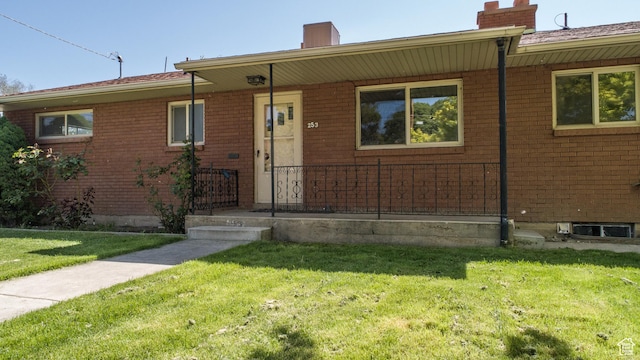 253 S 100 W, American Fork, UT 84003 - single story home featuring a chimney, a front lawn, and brick siding