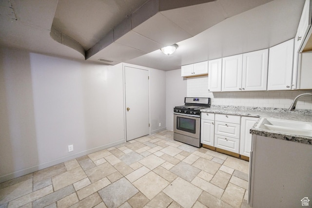 253 S 100 W, American Fork, UT 84003 - kitchen featuring gas range, a sink, white cabinetry, backsplash, and vaulted ceiling
