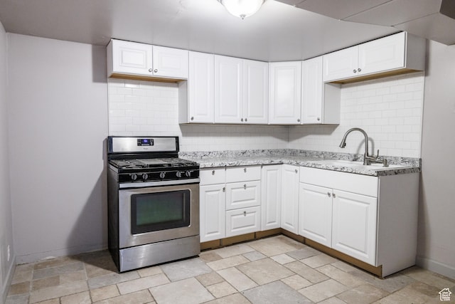 253 S 100 W, American Fork, UT 84003 - kitchen with stainless steel gas range oven, a sink, backsplash, and light stone finish flooring