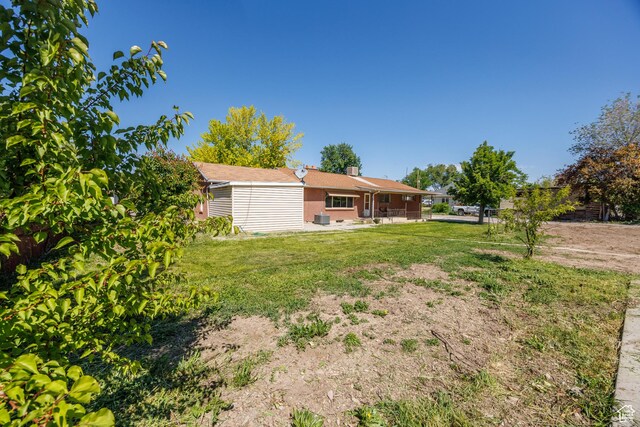 253 S 100 W, American Fork, UT 84003 - view of green lawn featuring a patio and central AC