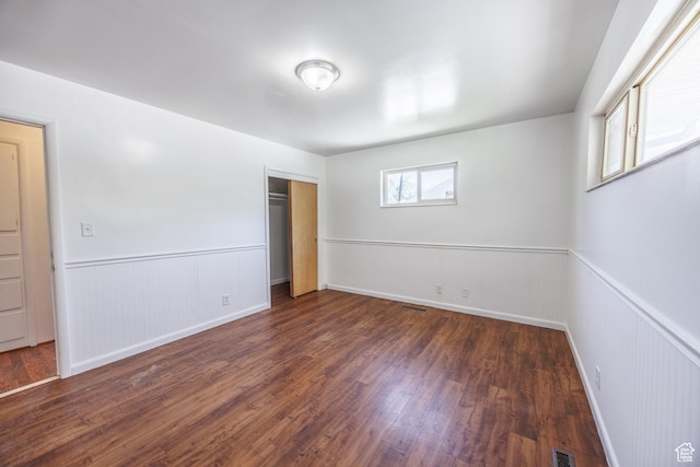 253 S 100 W, American Fork, UT 84003 - unfurnished bedroom with wood finished floors, a wainscoted wall, and a closet