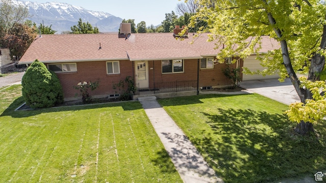 253 S 100 W, American Fork, UT 84003 - ranch-style home with a mountain view, brick siding, concrete driveway, and a front yard