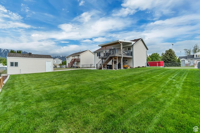 1874 W 180 S, Orem, UT 84059 - rear view of house featuring stairway, a wooden deck, and an outbuilding
