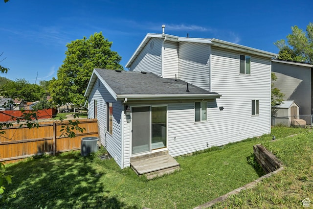 2240 S Lorin Cir W, Ogden, UT 84401 - back of property with entry steps, central air condition unit, and a shingled roof