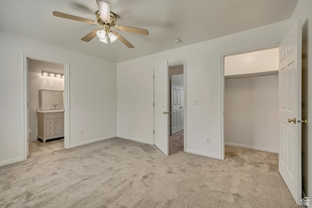 2240 S Lorin Cir W, Ogden, UT 84401 - unfurnished bedroom featuring a sink, light colored carpet, ensuite bathroom, and baseboards