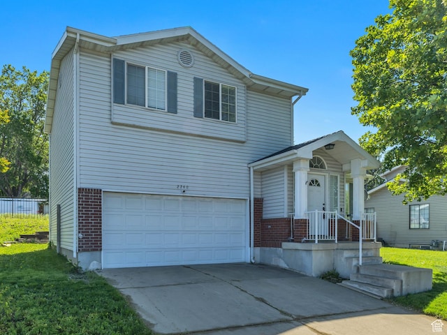 2240 S Lorin Cir W, Ogden, UT 84401 - traditional-style home featuring brick siding, a garage, and concrete driveway