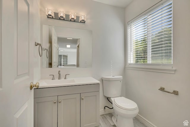 2240 S Lorin Cir W, Ogden, UT 84401 - half bathroom with baseboards, toilet, and vanity