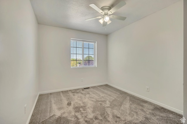 2240 S Lorin Cir W, Ogden, UT 84401 - spare room with ceiling fan, baseboards, carpet, and a textured ceiling