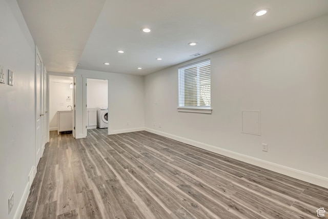 2240 S Lorin Cir W, Ogden, UT 84401 - below grade area featuring washer / clothes dryer, baseboards, wood finished floors, and recessed lighting