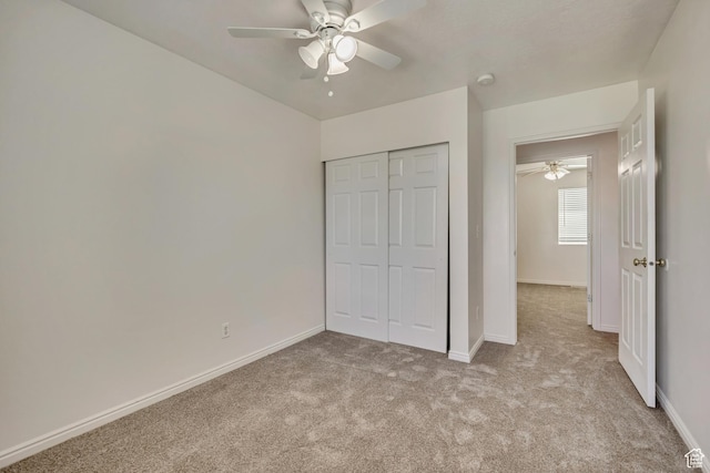 2240 S Lorin Cir W, Ogden, UT 84401 - unfurnished bedroom with light colored carpet, a closet, baseboards, and ceiling fan