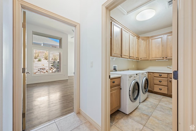 42 N 1100 W, St George, UT 84770 - laundry area with cabinet space, light tile patterned floors, washing machine and dryer, and baseboards