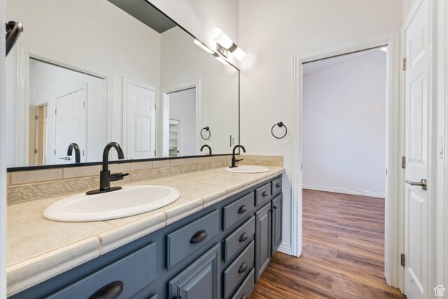 42 N 1100 W, St George, UT 84770 - full bathroom with double vanity, wood finished floors, and baseboards