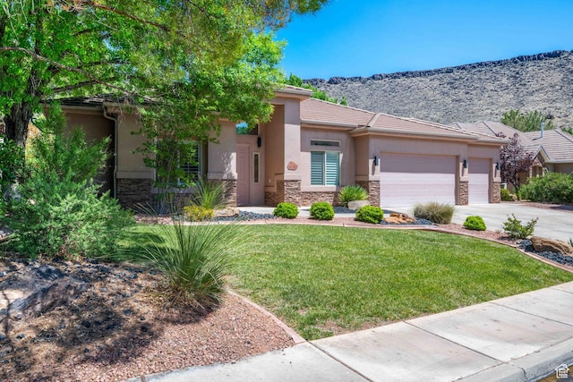 42 N 1100 W, St George, UT 84770 - view of front of home featuring stone siding, a garage, stucco siding, and a front yard