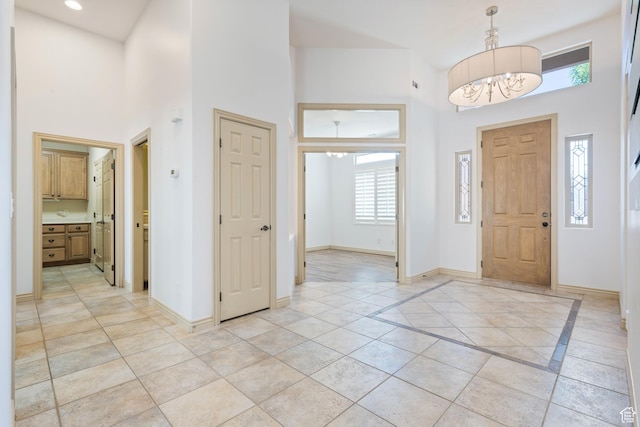 42 N 1100 W, St George, UT 84770 - foyer with a towering ceiling, plenty of natural light, a chandelier, and baseboards