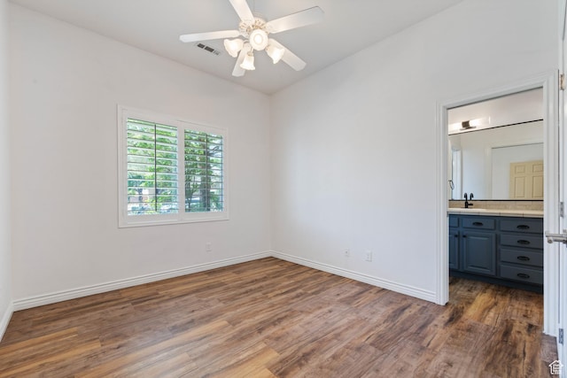42 N 1100 W, St George, UT 84770 - unfurnished bedroom with wood finished floors, a sink, and baseboards