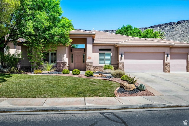 42 N 1100 W, St George, UT 84770 - prairie-style house with stone siding, stucco siding, and an attached garage