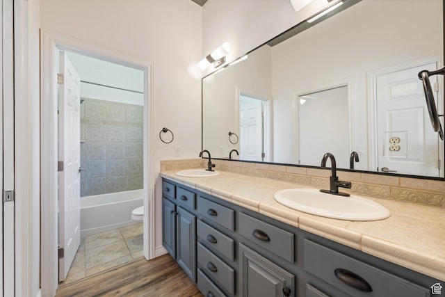 42 N 1100 W, St George, UT 84770 - bathroom with double vanity, toilet, shower / washtub combination, and wood finished floors