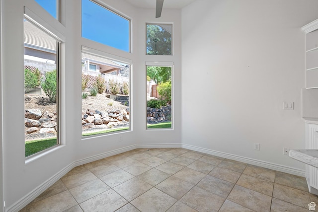 42 N 1100 W, St George, UT 84770 - spare room with light tile patterned flooring, a high ceiling, and baseboards