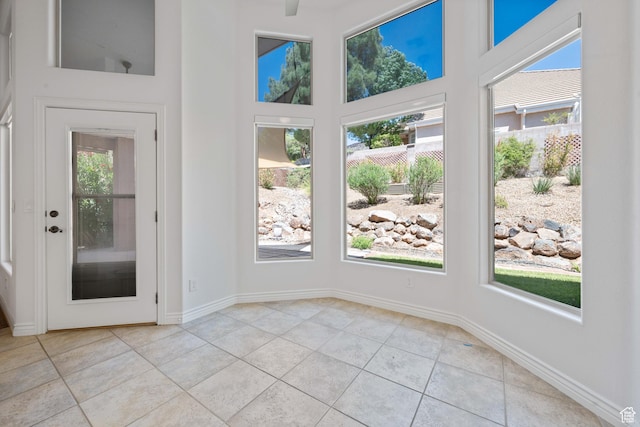 42 N 1100 W, St George, UT 84770 - empty room with light tile patterned floors, a high ceiling, and baseboards
