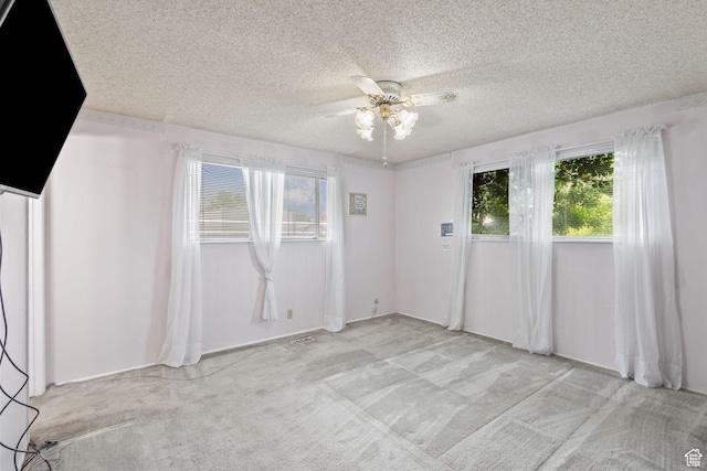 9216 S 2700 W, West Jordan, UT 84088 - spare room featuring light colored carpet, a ceiling fan, and a textured ceiling