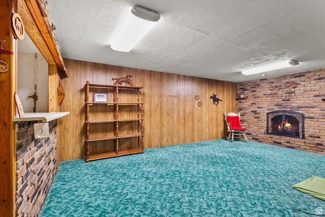 9216 S 2700 W, West Jordan, UT 84088 - finished below grade area with a brick fireplace, a textured ceiling, wood walls, and carpet