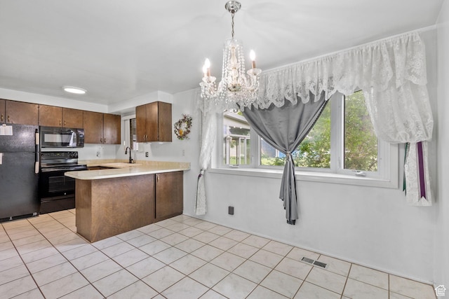 9216 S 2700 W, West Jordan, UT 84088 - kitchen featuring black appliances, a sink, light countertops, a peninsula, and a chandelier