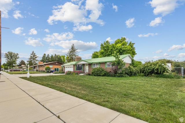 9216 S 2700 W, West Jordan, UT 84088 - ranch-style home featuring driveway, an attached garage, a front yard, and a chimney