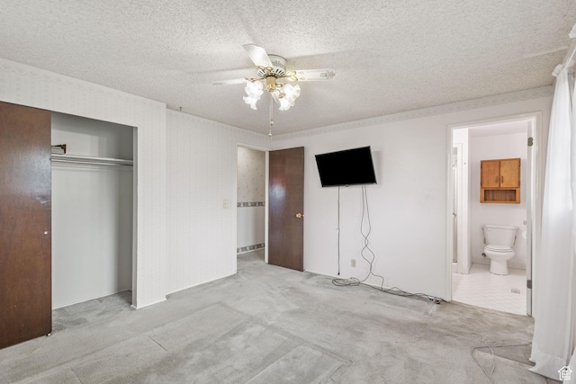 9216 S 2700 W, West Jordan, UT 84088 - unfurnished bedroom featuring carpet, a closet, a textured ceiling, ensuite bath, and ceiling fan