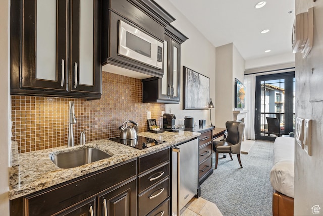 2100 Frostwood Blvd Unit 5130, Snyderville, UT 84098 - kitchen with a sink, dark brown cabinetry, black electric cooktop, backsplash, and recessed lighting