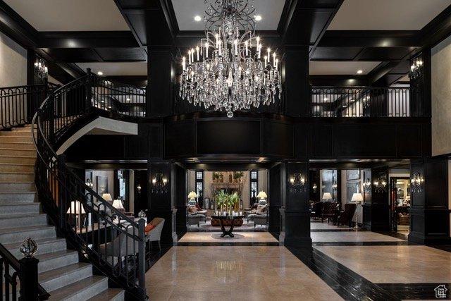 2100 Frostwood Blvd Unit 5130, Snyderville, UT 84098 - community lobby featuring stairway, a high ceiling, and coffered ceiling