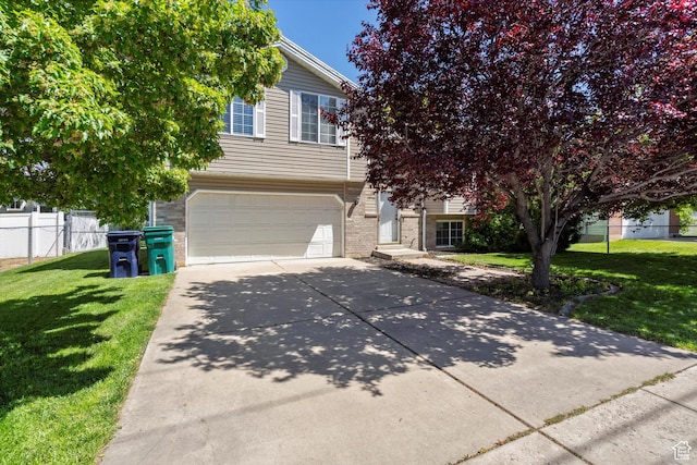 3916 W 4800 S, Roy, UT 84067 - obstructed view of property featuring a garage, driveway, and brick siding