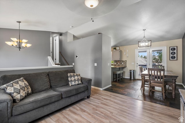 3916 W 4800 S, Roy, UT 84067 - living room featuring a chandelier, wood finished floors, baseboards, vaulted ceiling, and ceiling fan