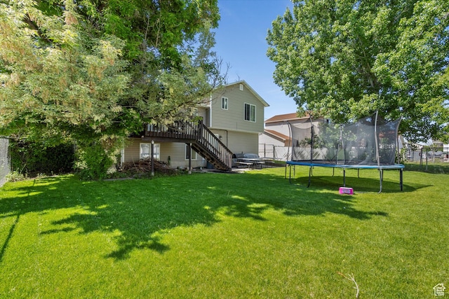 3916 W 4800 S, Roy, UT 84067 - view of yard featuring a trampoline, stairway, and a deck