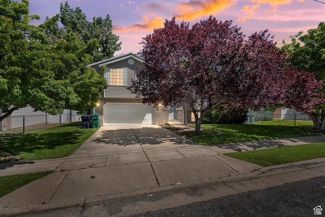 3916 W 4800 S, Roy, UT 84067 - view of property hidden behind natural elements featuring a garage, driveway, and brick siding